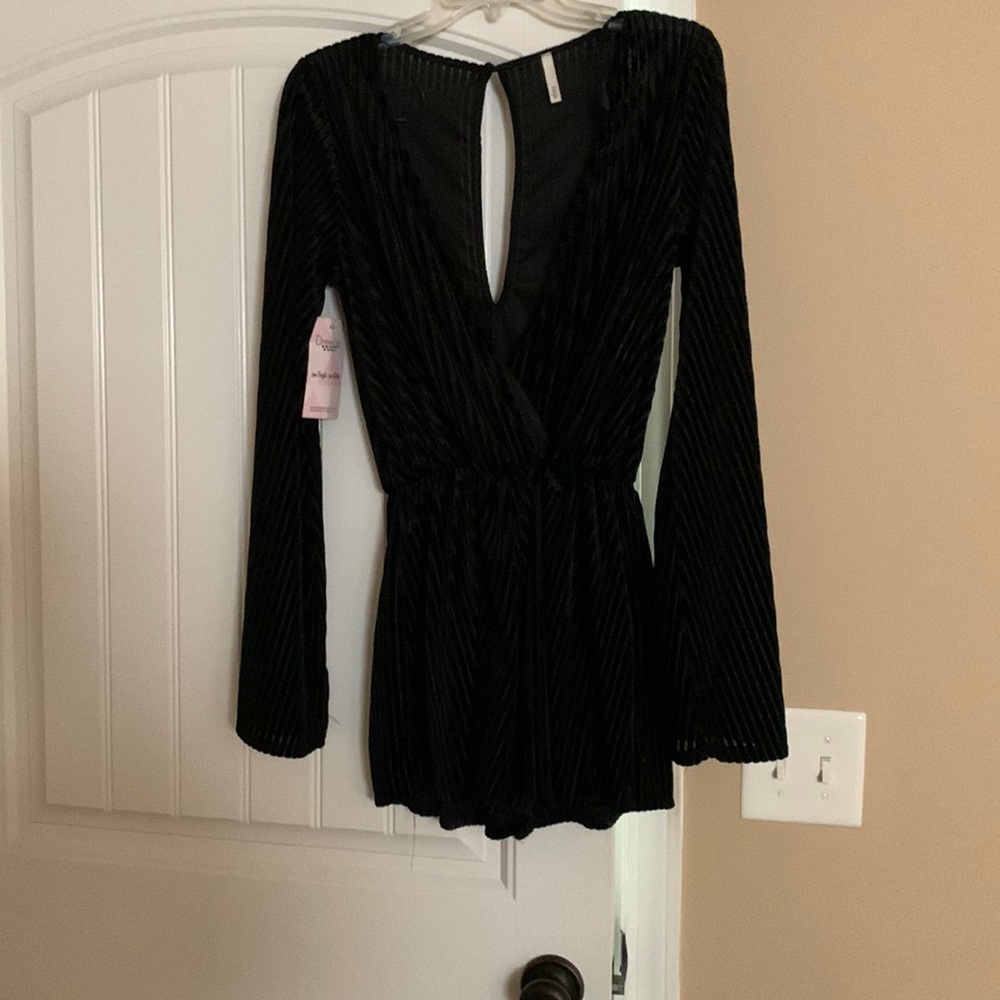 Black romper size large never worn